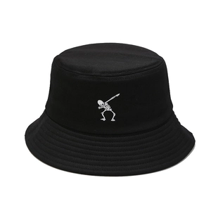 Black cotton bucket hat featuring a white skeleton dabbing embroidery in a punk hip-hop style