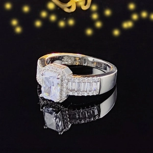 Macro view of S925 sterling silver ring with emerald-cut rectangle gemstone and side diamonds