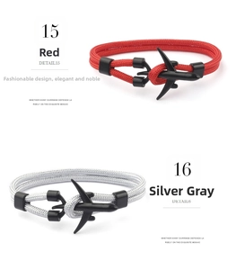 Detail of red and grey woven rope bracelets with airplane shaped matte black buckles