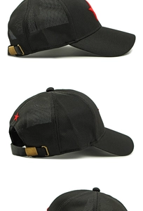 Detail of black mesh baseball cap showing breathable texture and red star embroidery