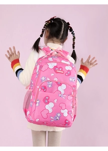Pink school backpack for girls with cute rabbit and heart patterns shown from the back