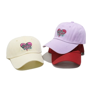 Classic cotton baseball caps in beige, lavender, and red with heart embroidery detail