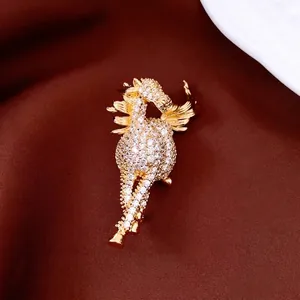 Exquisite 14K gold-plated horse brooch with pavé zircon stones on brown satin