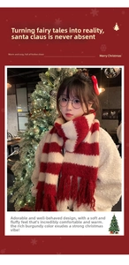 Detail shot of the red and white striped knit scarf with decorative fringe accents