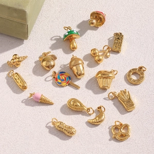 Detailed view of 18K gold-plated stainless steel food charms with colorful enamel finish