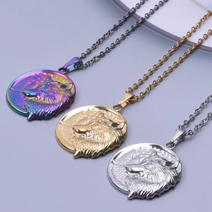 Detailed view of wolf head pendants in gold, silver and rainbow plated stainless steel