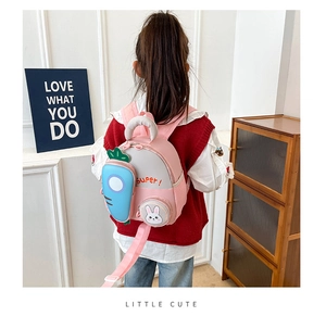 Pink cartoon kids backpack with blue carrot pocket and Super bunny patch on the back