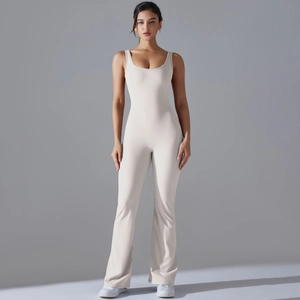 Front view of sleeveless cream yoga jumpsuit with flared legs and slim fit design