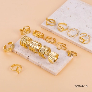 15-piece gold-plated stainless steel ring set with star, chain, and layered designs