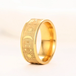 Macro shot of gold sun moon star celestial ring with matte finish and polished edges