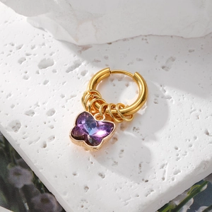 Chic gold hoop earring featuring a delicate purple crystal butterfly on white stone