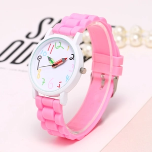 Macro side view of pink silicone watch featuring pencil-shaped hands and colored numbers