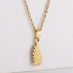 Minimalist gold feather pendant necklace in 304 stainless steel for women on white background