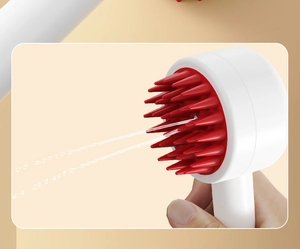 Detail showing the spray function and silicone bristles of the scalp massage brush