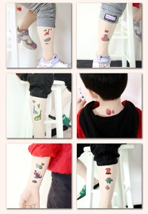 Detailed view of glittering cartoon dinosaur temporary tattoos applied on children's skin
