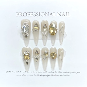 Luxury champagne gold press-on nails with sparkling rhinestones and elegant tassels