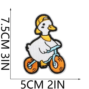 Detail view of cartoon duck embroidery patch with size measurements 7.5x5cm