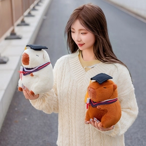 Cute capybara plush toy in graduation gown and doctoral cap for student gift