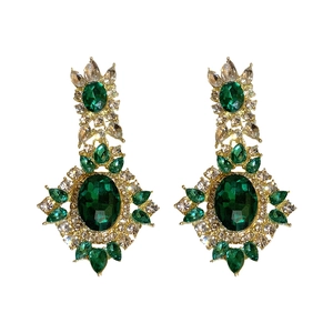Vintage gold earrings with emerald green crystals and floral halo design for women