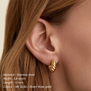 Vintage geometric twisted croissant hoop earrings in polished gold stainless steel