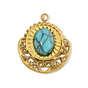 Detail of vintage gold-plated teardrop pendant with turquoise stone and sunburst pattern