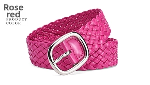 Detail of rose red braided PU leather belt featuring a polished silver metal buckle