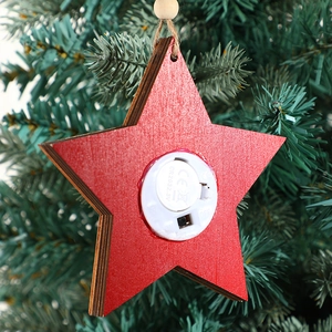 Star-shaped wooden Christmas LED sign showing back battery compartment and switch