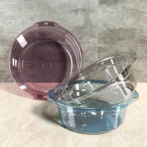 Set of three transparent plastic washbasins in purple and blue with side handles