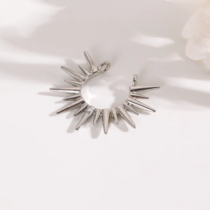Silver sunburst charm pendant with dual loops for DIY jewelry making on white background