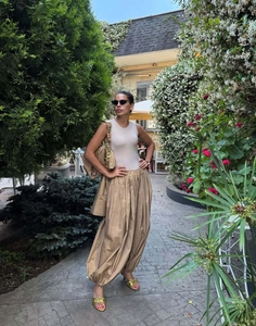 Close-up of high-waist khaki lantern pants and crop top set for women street style
