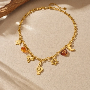 Gold vintage stainless steel necklace with sun, moon and music note charms