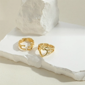 French vintage style gold heart hollow ring and multilayer layered ring on white stones