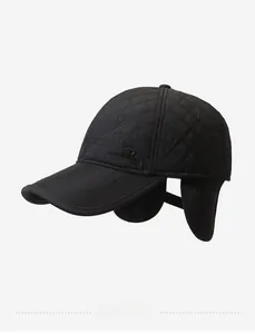 Close-up of black quilted baseball cap for men with ear flaps and embossed R logo