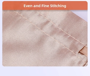 Detail view of champagne satin storage pouch featuring precision double-stitched sewing lines