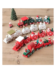 Close-up of wooden Christmas train decor with snowman and Santa figures on wood table