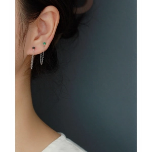 Elegant S925 silver drop earrings with green and black zircons worn by a model
