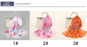 Detailed color display showing three floral chiffon scarves on a handbag accessory