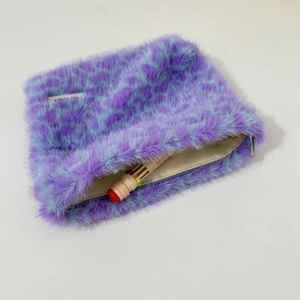 Detail view of purple and blue leopard plush pouch showing inner storage and zipper