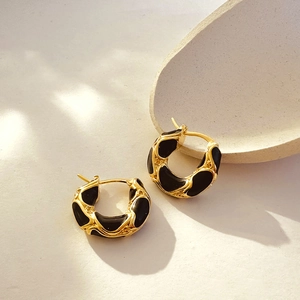 18K gold plated hoop earrings with black enamel snake texture and lava ripple design