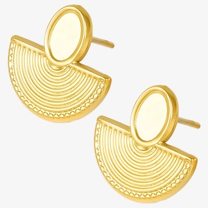 Detail of gold vintage fan earrings with concentric textures and oval metal studs