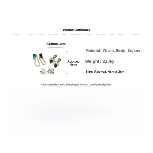 Detailed view of silver needle heart stud earrings set with zircon and resin materials