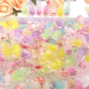 Cute glowing cartoon bottle keychains in various colors with heart shaped hooks