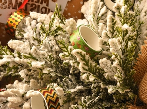 Detail of Christmas washi tape with gold foil patterns on festive evergreen branches