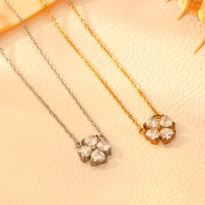 Minimalist titanium steel clover necklace featuring heart-shaped zirconia crystals