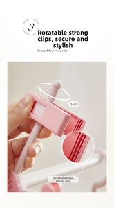 Detail of pink 360-degree rotating clip with anti-slip sawtooth design for kids hangers