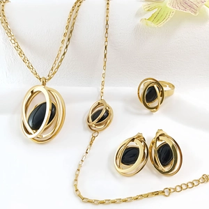Detail view of the elegant four-piece jewelry set including necklace, bracelet and ring