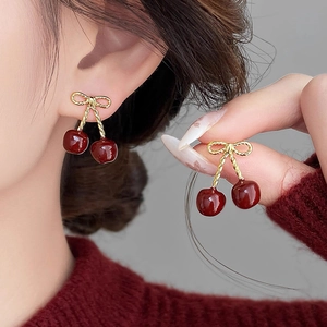 Elegant cherry drop earrings with golden resin bow and glossy deep red cherry pendants