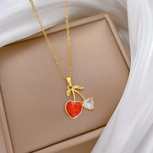 Elegant gold titanium steel necklace featuring a sparkling red and white cherry heart pendant