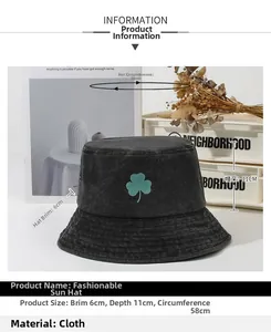 Detailed view of black bucket hat with shamrock embroidery and size measurements