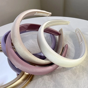 Elegant padded satin headbands in cream, champagne, and purple silk-like fabric set